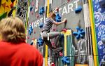 Leisure transformation girl on climbing wall