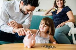 Family saving money in a piggy bank