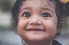 Close up portrait of a smiling baby girl