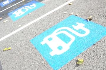 Electric charging point signs on road