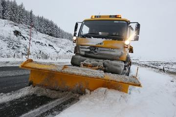 Gritter clearing snow from roads